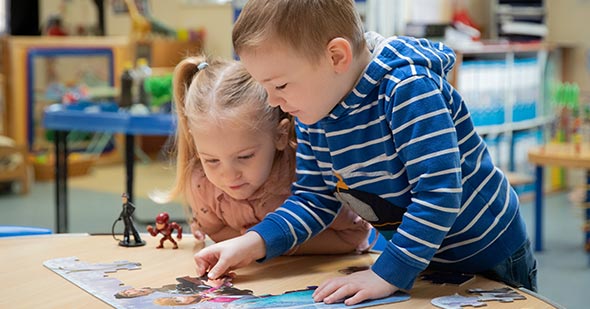 Children Playing With Jigsaw